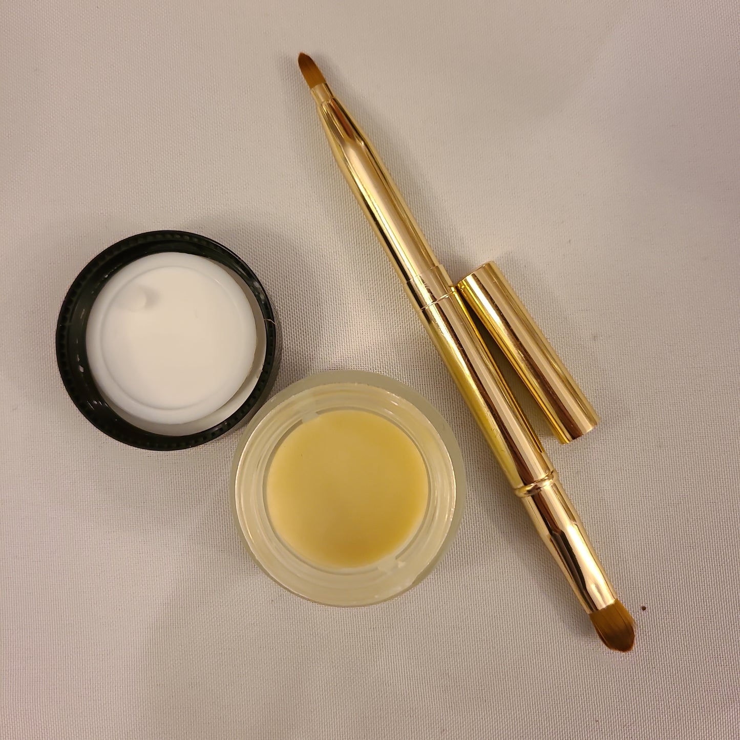 Healing lip balm and beauty brush by Lisa Louise